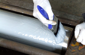 A Brake Roller in an MOT Test Station being re-coated and re-gritted.
